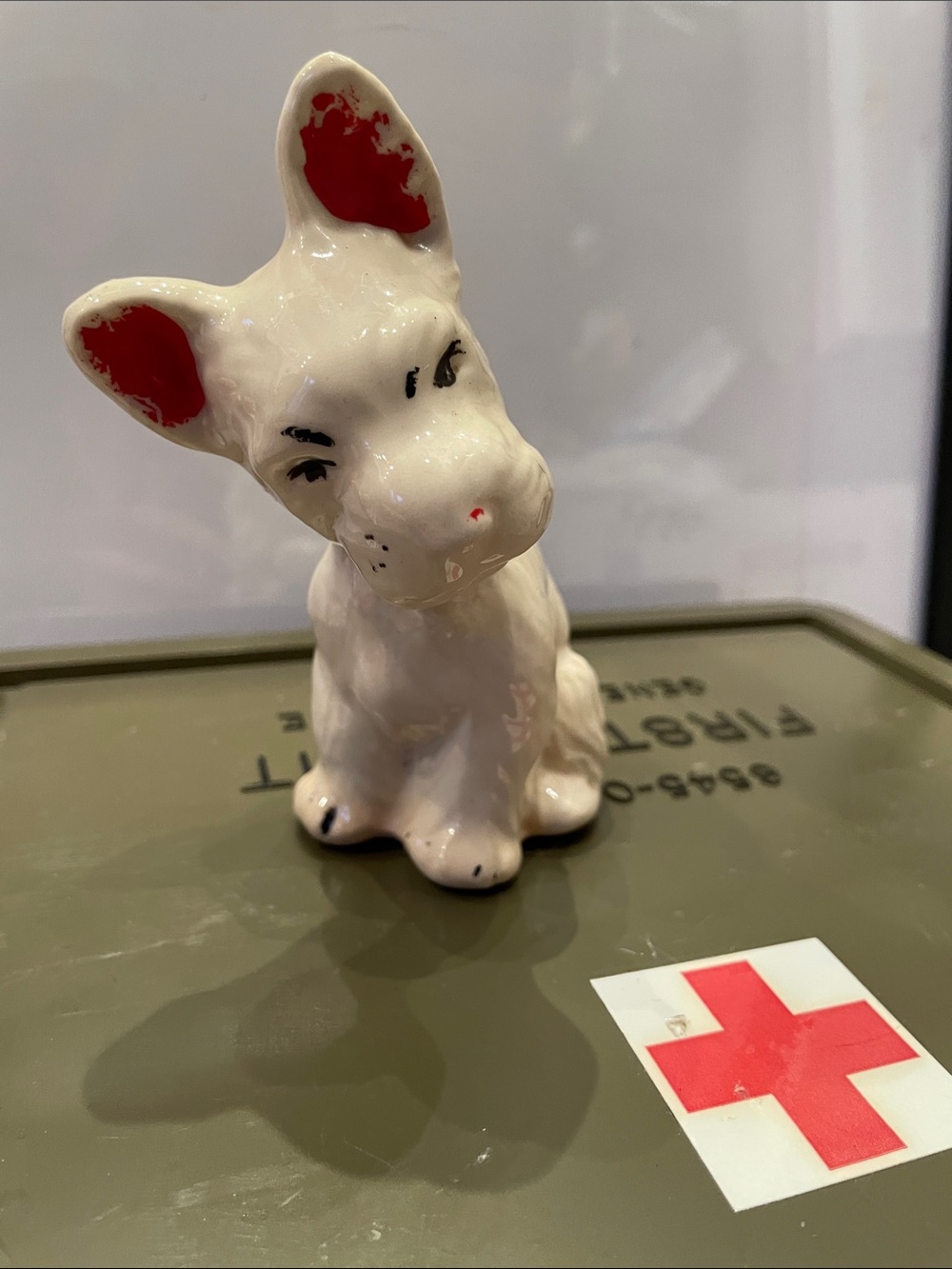 White Ceramic Dog Figurine with Red Ear and Nose Accents